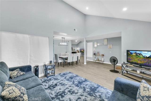 1264 N Mulberry Ave, Rialto, CA 92376 - living area featuring a chandelier, wood finished floors, high vaulted ceiling, and recessed lighting