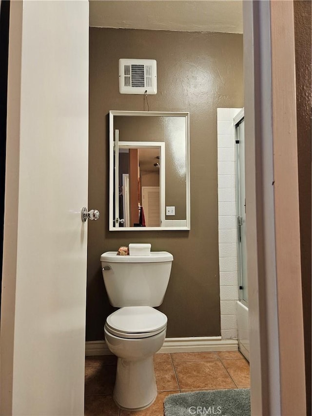 2620 2nd Ave Unit 5B, San Diego, CA 92103 - bathroom featuring baseboards, toilet, tile patterned flooring, and enclosed tub / shower combo
