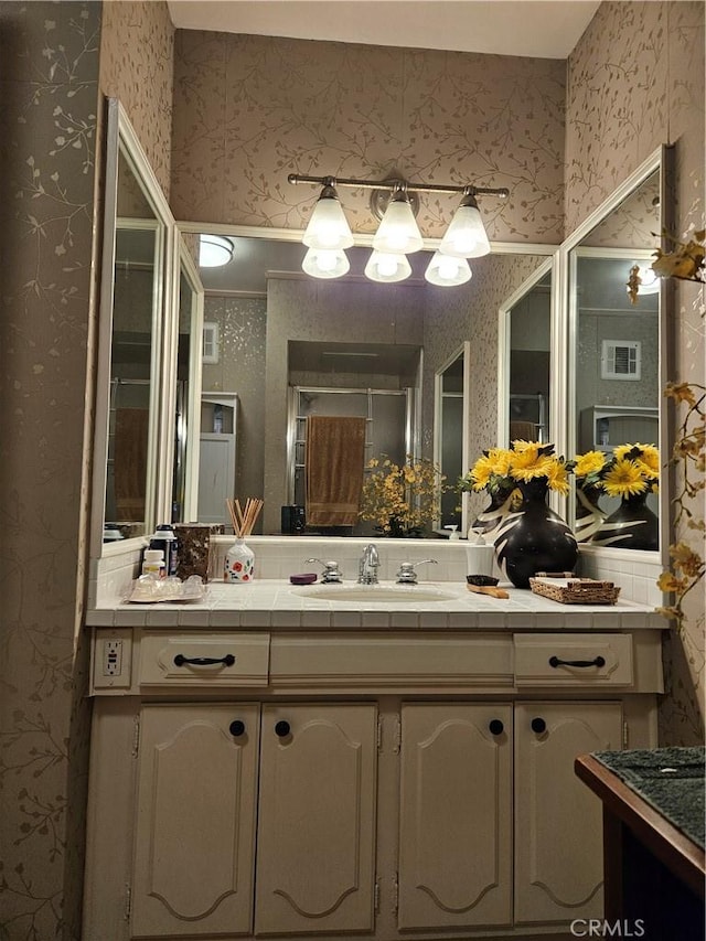 2620 2nd Ave Unit 5B, San Diego, CA 92103 - full bath with wallpapered walls and vanity