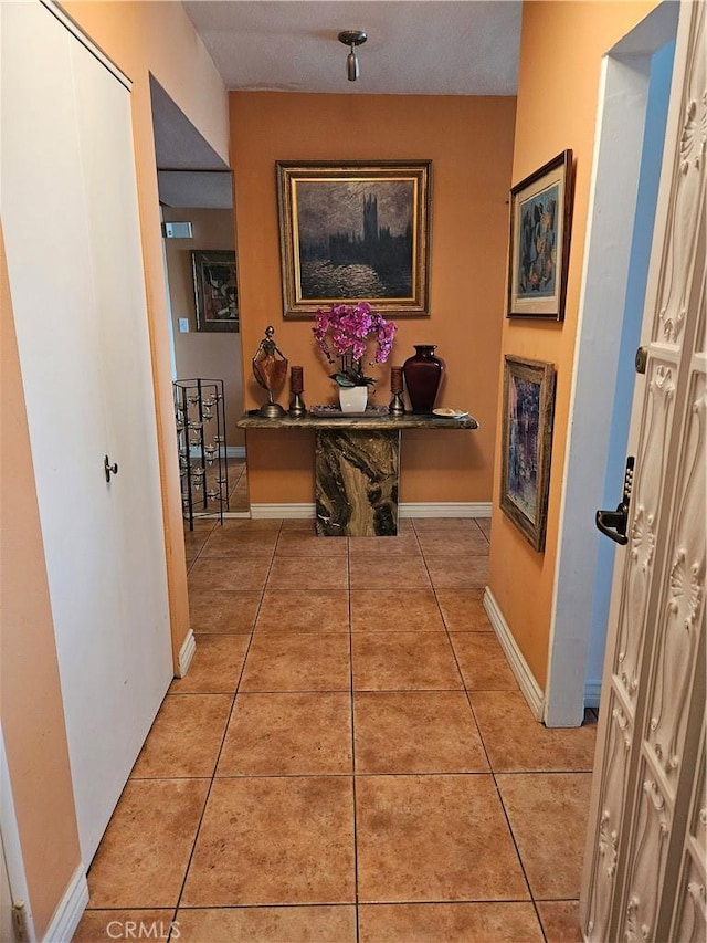 2620 2nd Ave Unit 5B, San Diego, CA 92103 - hallway with light tile patterned floors and baseboards