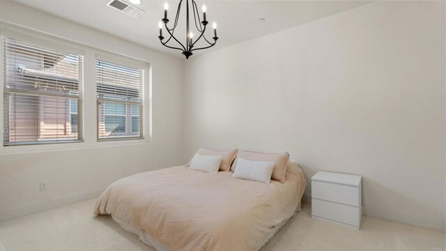 2510 Aperture Cir, San Diego, CA 92108 - bedroom with light carpet and a chandelier