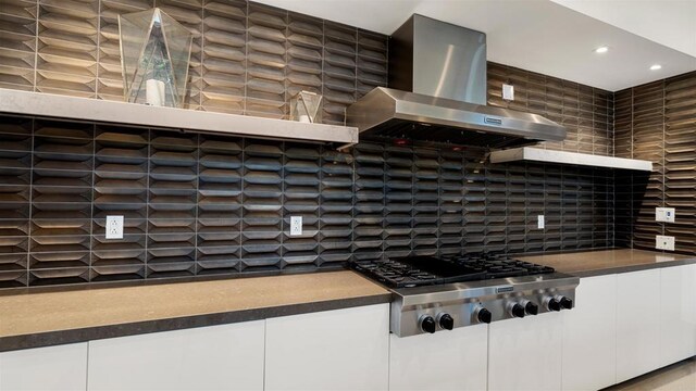 2510 Aperture Cir, San Diego, CA 92108 - kitchen with wall chimney exhaust hood, stainless steel gas stovetop, dark countertops, decorative backsplash, and white cabinetry