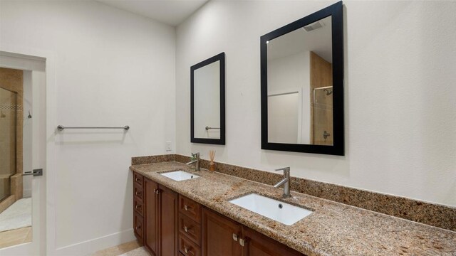 2510 Aperture Cir, San Diego, CA 92108 - bathroom featuring a shower stall, double vanity, and baseboards