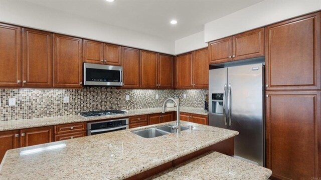 2510 Aperture Cir, San Diego, CA 92108 - kitchen with stainless steel appliances, a sink, light stone countertops, decorative backsplash, and recessed lighting
