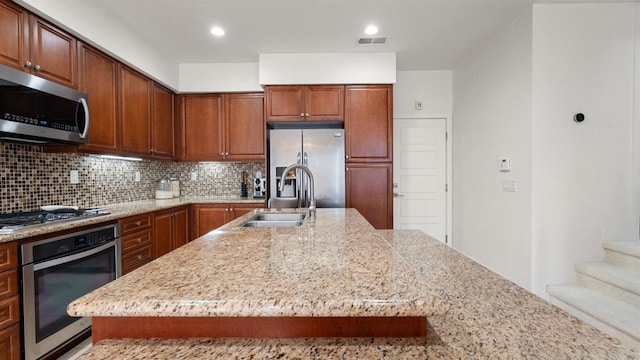 2510 Aperture Cir, San Diego, CA 92108 - kitchen with appliances with stainless steel finishes, a sink, decorative backsplash, light stone counters, and recessed lighting
