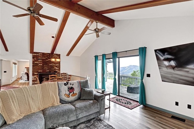 30396 Live Oak Dr, Running Springs, CA 92382 - living room featuring a ceiling fan, wood finished floors, baseboards, and a fireplace