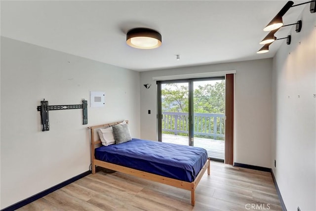 30396 Live Oak Dr, Running Springs, CA 92382 - bedroom featuring access to outside, wood finished floors, and baseboards