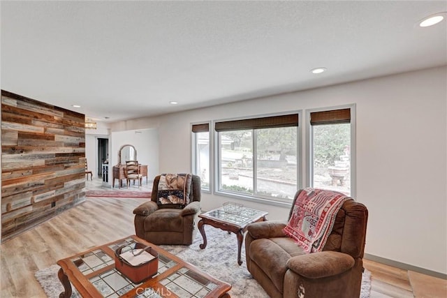 30396 Live Oak Dr, Running Springs, CA 92382 - living room with recessed lighting, light wood-style floors, wood walls, and baseboards