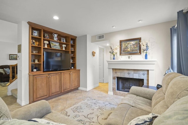 5084 Via Calderon, Camarillo, CA 93012 - living room with a tiled fireplace, recessed lighting, light tile patterned floors, and baseboards