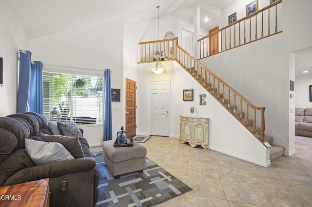 5084 Via Calderon, Camarillo, CA 93012 - tiled living room featuring high vaulted ceiling, baseboards, and stairs