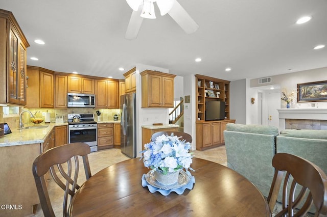 5084 Via Calderon, Camarillo, CA 93012 - dining space featuring recessed lighting, a ceiling fan, light tile patterned floors, and a fireplace