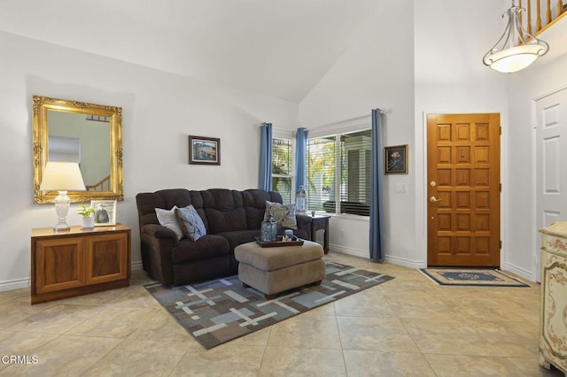 5084 Via Calderon, Camarillo, CA 93012 - tiled living area featuring high vaulted ceiling and baseboards