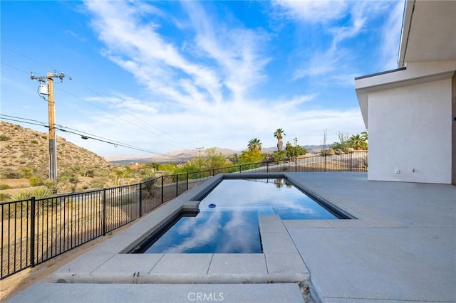 6218 Farrelo Rd, Yucca Valley, CA 92284 - view of swimming pool with a patio area, a mountain view, and a pool with connected hot tub
