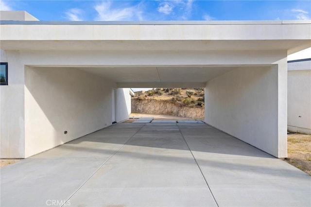 6218 Farrelo Rd, Yucca Valley, CA 92284 - view of parking / parking lot with a carport and concrete driveway
