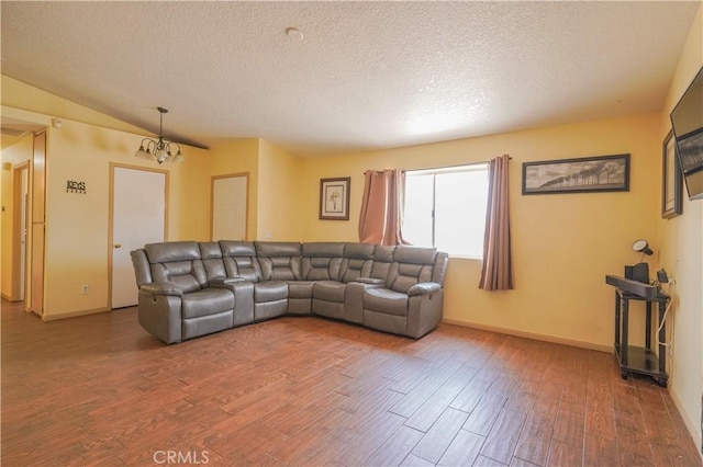 22780 Shawnee Rd, Apple Valley, CA 92308 - living area with wood finished floors, a textured ceiling, a chandelier, baseboards, and lofted ceiling