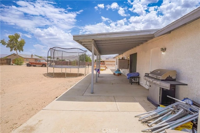 22780 Shawnee Rd, Apple Valley, CA 92308 - fenced backyard featuring a trampoline, a patio, and grilling area