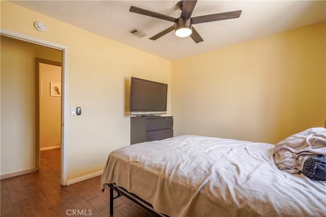 22780 Shawnee Rd, Apple Valley, CA 92308 - bedroom featuring wood finished floors, baseboards, ceiling fan, and a textured ceiling