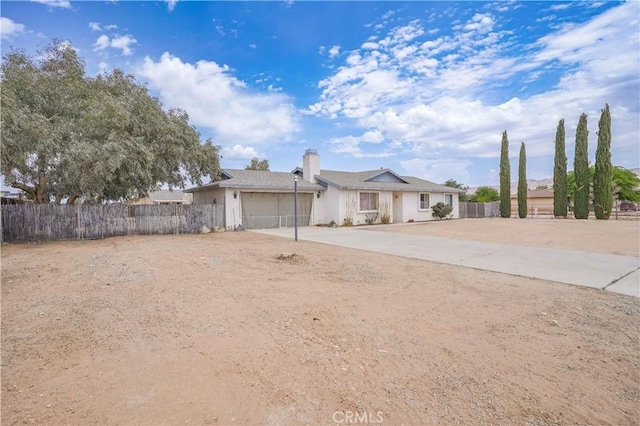 22780 Shawnee Rd, Apple Valley, CA 92308 - ranch-style home with driveway, a garage, and a chimney