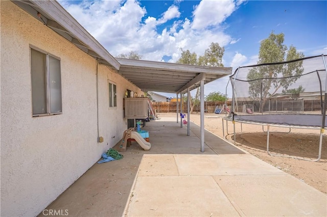 22780 Shawnee Rd, Apple Valley, CA 92308 - fenced backyard featuring a trampoline and a patio