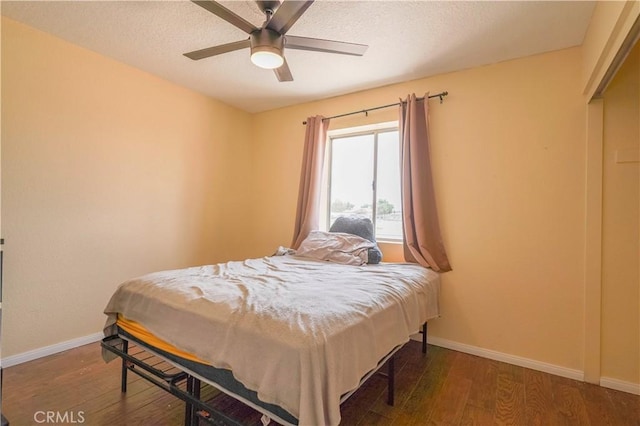 22780 Shawnee Rd, Apple Valley, CA 92308 - bedroom featuring wood finished floors, baseboards, ceiling fan, and a textured ceiling