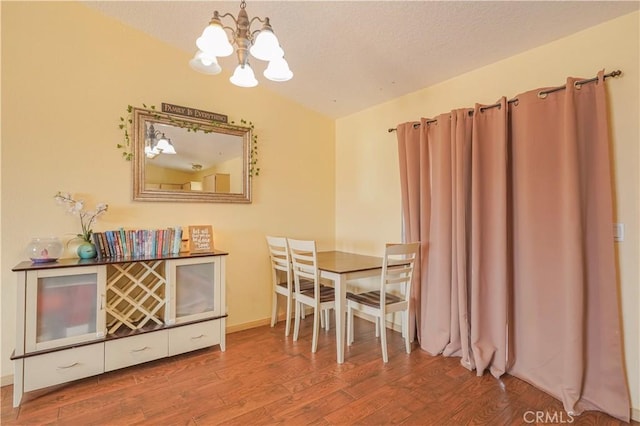 22780 Shawnee Rd, Apple Valley, CA 92308 - dining room featuring a chandelier, wood finished floors, and a textured ceiling