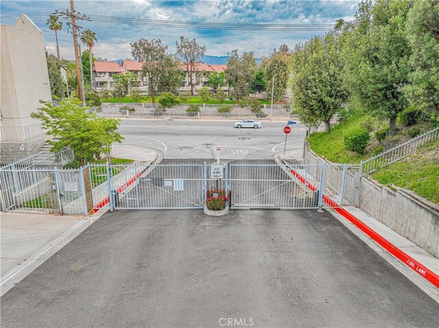 18209 Sierra Unit 45, Canyon Country, CA 91351 - view of vehicle parking featuring a gate