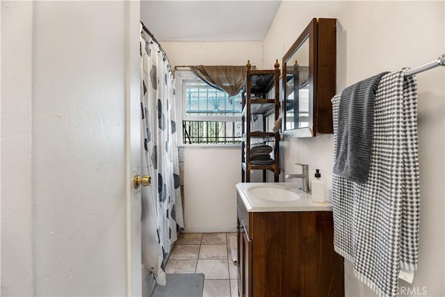 614 N Spring Ave, Compton, CA 90221 - full bath featuring vanity, a shower with curtain, and tile patterned floors