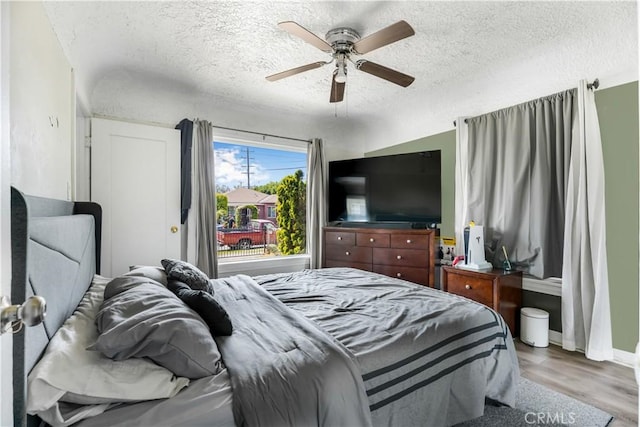 614 N Spring Ave, Compton, CA 90221 - bedroom featuring a textured ceiling, wood finished floors, ceiling fan, and baseboards