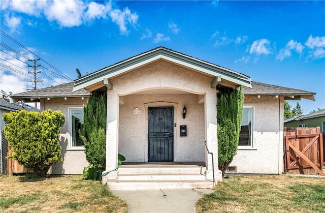 614 N Spring Ave, Compton, CA 90221 - property entrance with stucco siding and roof with shingles
