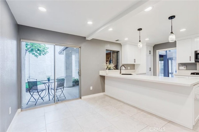 1320 Shadow Cir, Upland, CA 91784 - kitchen with light countertops, baseboards, white cabinetry, stainless steel microwave, and recessed lighting