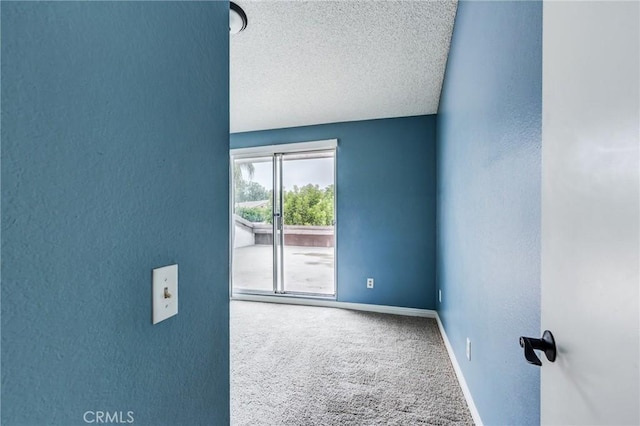 1320 Shadow Cir, Upland, CA 91784 - empty room with carpet, a textured ceiling, baseboards, and a textured wall