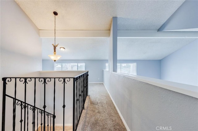 1320 Shadow Cir, Upland, CA 91784 - hallway with carpet, an upstairs landing, plenty of natural light, a textured ceiling, and baseboards