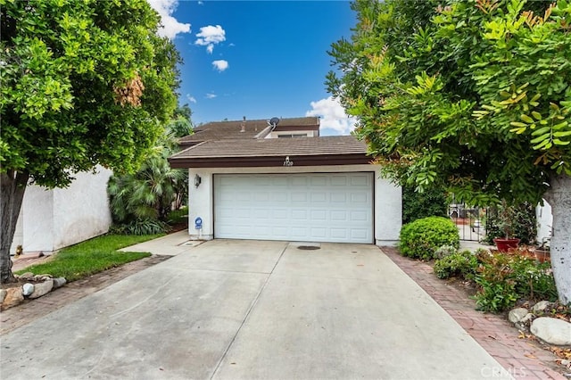 1320 Shadow Cir, Upland, CA 91784 - view of front of house with driveway, stucco siding, and an attached garage