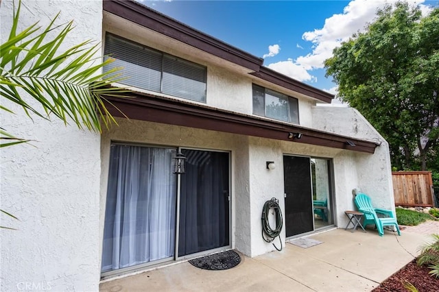 1320 Shadow Cir, Upland, CA 91784 - rear view of property featuring stucco siding and a patio area