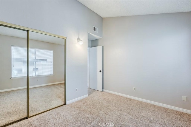 1320 Shadow Cir, Upland, CA 91784 - unfurnished bedroom with carpet floors, a closet, baseboards, and high vaulted ceiling