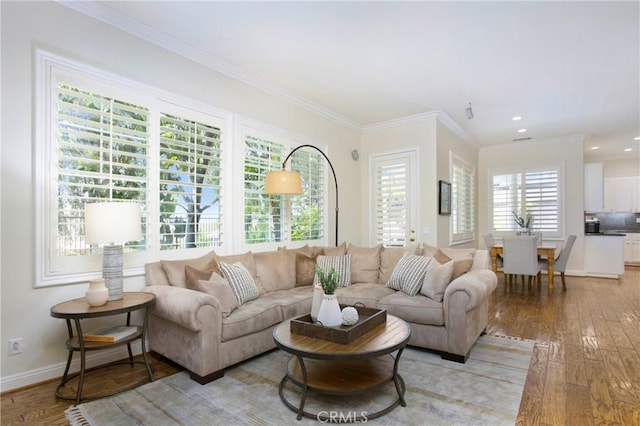 15 Beacon, Ladera Ranch, CA 92694 - living room featuring light wood-type flooring, baseboards, ornamental molding, and recessed lighting