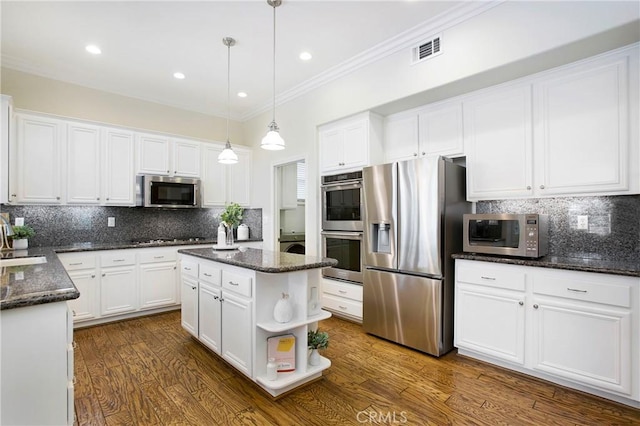 15 Beacon, Ladera Ranch, CA 92694 - kitchen with appliances with stainless steel finishes, white cabinetry, ornamental molding, backsplash, and open shelves