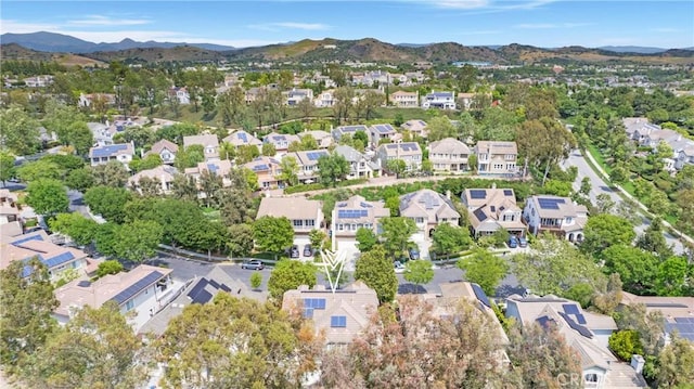 15 Beacon, Ladera Ranch, CA 92694 - aerial overview of property's location featuring nearby suburban area and a mountainous background