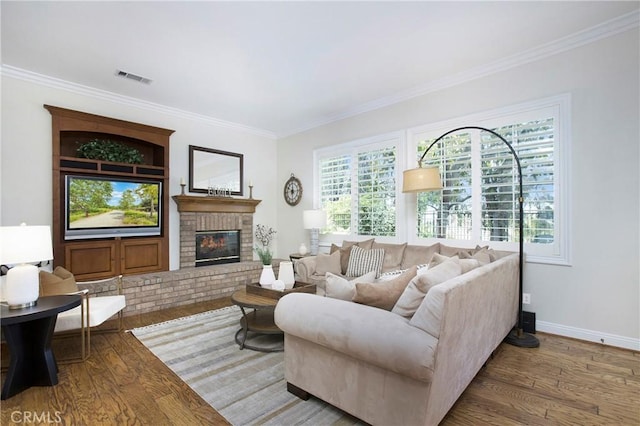 15 Beacon, Ladera Ranch, CA 92694 - living room with wood finished floors, crown molding, a brick fireplace, and baseboards