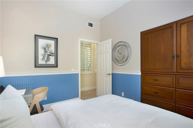 15 Beacon, Ladera Ranch, CA 92694 - tiled bedroom featuring wainscoting and vaulted ceiling