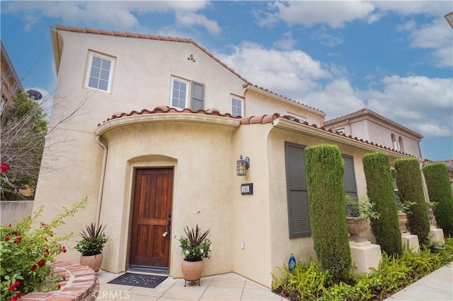 11451 Ghiberti Way, Porter Ranch, CA 91326 - view of front of home with stucco siding