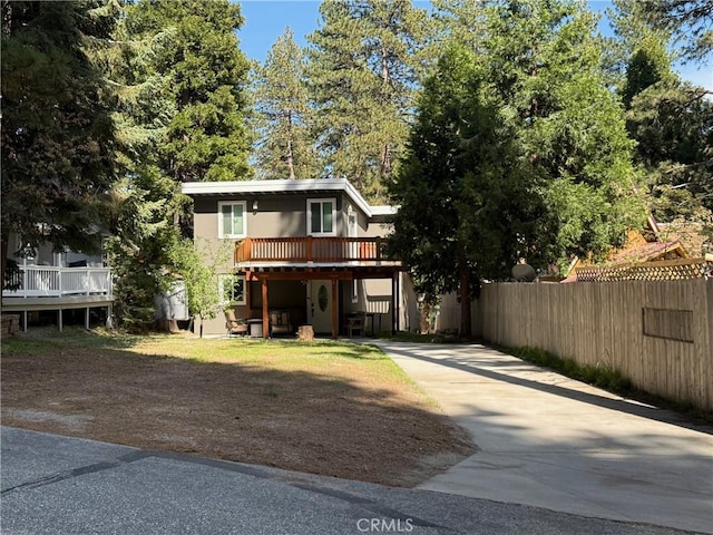 2557 Whispering Pines Dr, Running Springs, CA 92382 - view of front of property with concrete driveway and a wooden deck