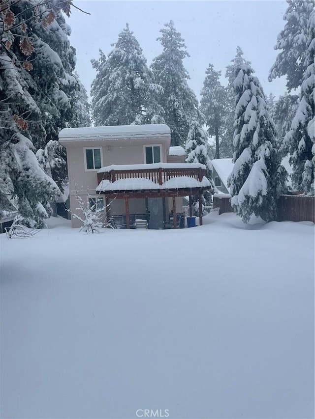 2557 Whispering Pines Dr, Running Springs, CA 92382 - snow covered back of property featuring a deck