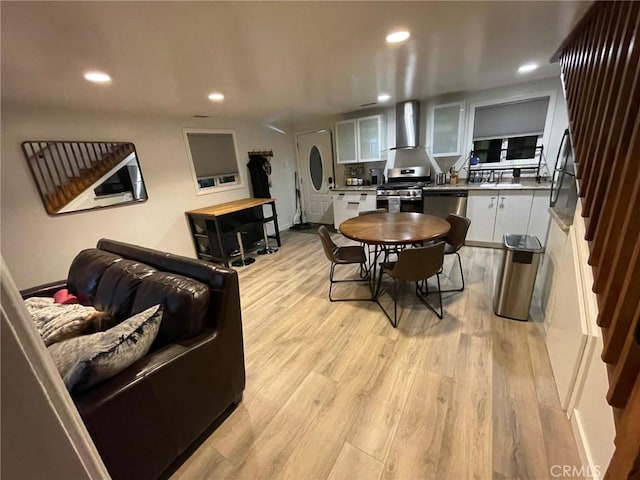 2557 Whispering Pines Dr, Running Springs, CA 92382 - dining area featuring light wood-style flooring, recessed lighting, and stairs