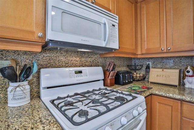 9793 Louise Way, Rancho Cucamonga, CA 91730 - kitchen featuring white appliances, decorative backsplash, light stone counters, and brown cabinets