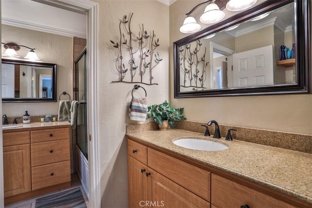 9793 Louise Way, Rancho Cucamonga, CA 91730 - bathroom with ornamental molding, vanity, a textured wall, and combined bath / shower with glass door