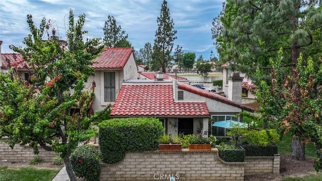9793 Louise Way, Rancho Cucamonga, CA 91730 - rear view of house featuring a tile roof and stucco siding