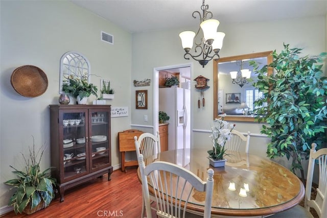 9793 Louise Way, Rancho Cucamonga, CA 91730 - dining area with a chandelier and wood finished floors