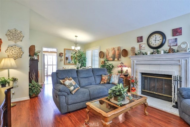 9793 Louise Way, Rancho Cucamonga, CA 91730 - living area featuring wood finished floors, a fireplace, and baseboards