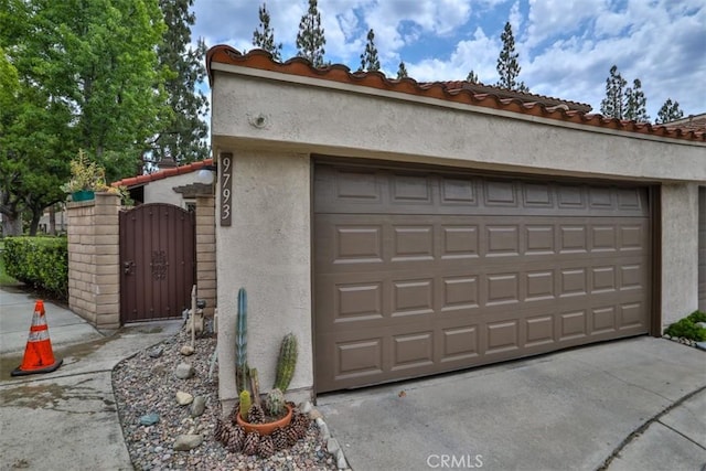 9793 Louise Way, Rancho Cucamonga, CA 91730 - garage featuring a gate and driveway